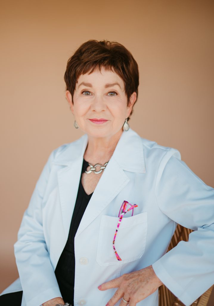 Dr. Jenine Tanabe MD in a lab coat